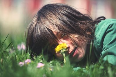 Close-up of child on grass