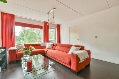 View of red sofa in living room