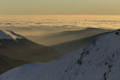 Scenic view of snow covered mountains against sky during sunset, fagaras mountains