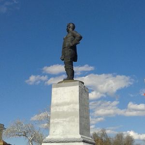 Low angle view of statue against blue sky