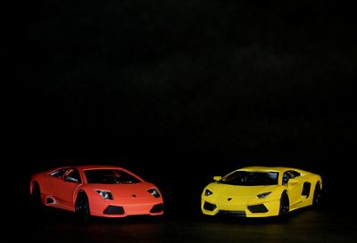 Toy car against black background