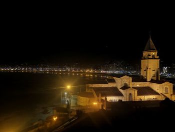 Illuminated buildings in city at night