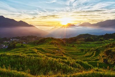 Scenic view of landscape against sky during sunset