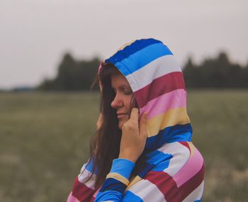 Low section of woman wearing shoes on land