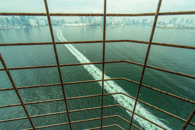 High angle view of water wake in sea seen through window