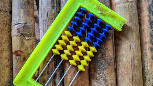 High angle view of multi colored toy on wood