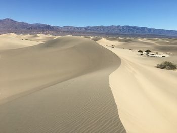 Scenic view of desert against clear sky