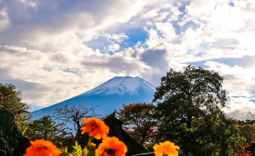 Scenic view of mountains against cloudy sky
