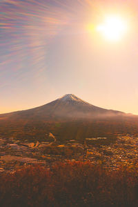 Scenic view of landscape against sky during sunset