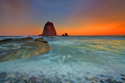 Scenic view of sea against sky during sunset