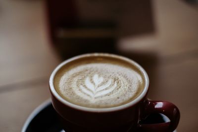 Close-up of cappuccino on table