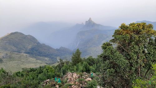Beautiful scenic view from kodanad view point ooty of misty rain cloud hill mountain green forest