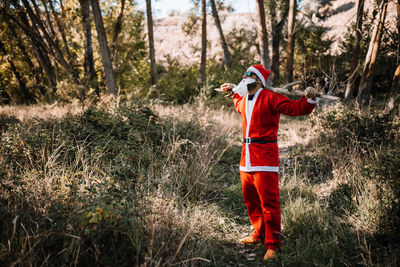 Man wearing costume while standing in forest