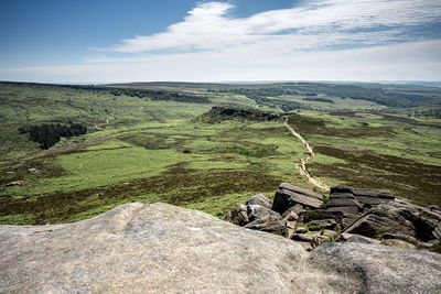 Ancient iron age hill fort carl wark from higger tor in the peak district national park, derbyshire.