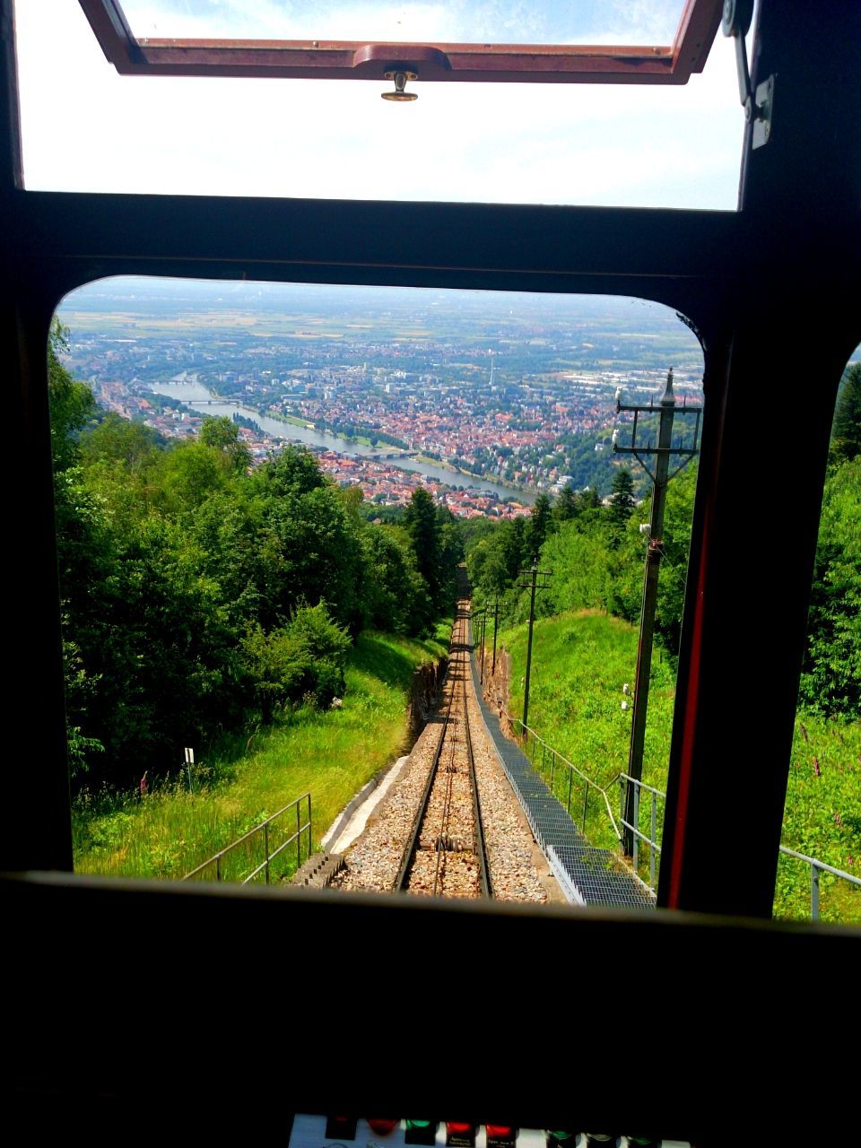 transportation, vehicle interior, mode of transport, glass - material, transparent, tree, public transportation, landscape, railroad track, rail transportation, sky, window, windshield, travel, the way forward, indoors, field, diminishing perspective, grass, car