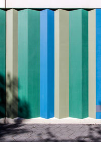 Multi colored wall by swimming pool