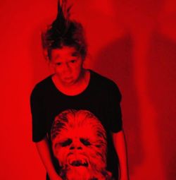 Portrait of happy man against red background