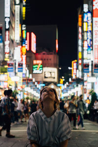 Man in city at night