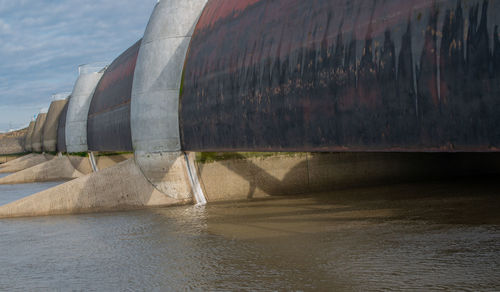 High angle view of dam by river against sky