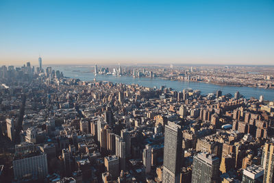 Aerial view of cityscape against sky during sunset