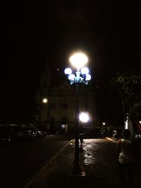 View of illuminated street at night