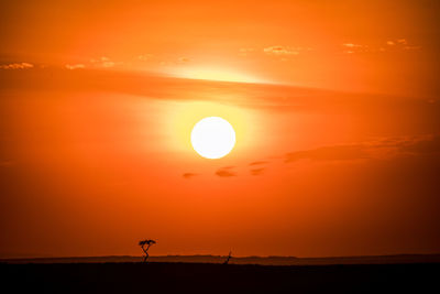 Scenic view of silhouette landscape against romantic sky at sunset