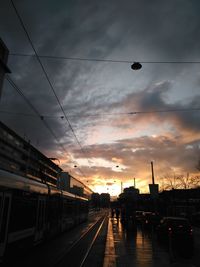 Street light against cloudy sky