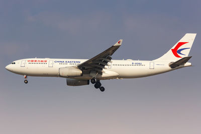 Airplane flying against clear sky