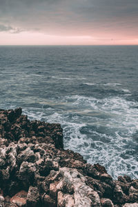 Scenic view of sea against sky at sunset
