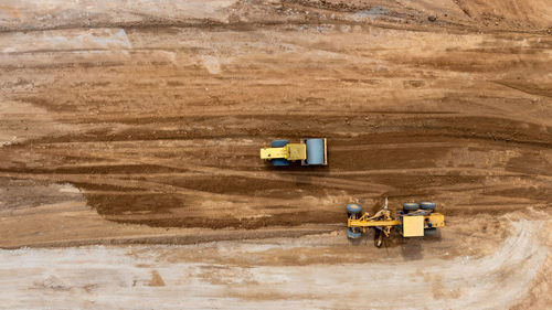 Aerial view motor grader civil at construction site, motor grader work on construction site, road