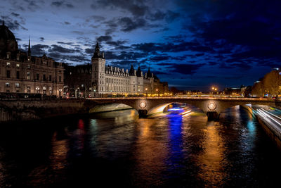 Bridge over river with buildings in background