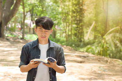 Portrait of a young man in forest