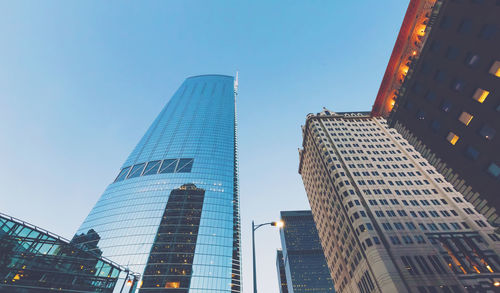 Low angle view of modern buildings against clear sky