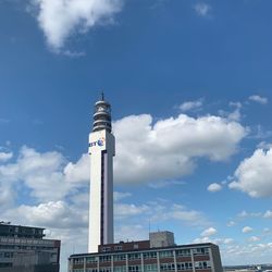 Low angle view of building against cloudy sky