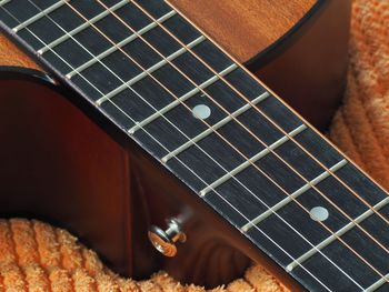 Close-up of guitar playing piano