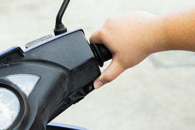 Close-up of woman holding camera