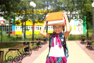 Portrait of cute girl standing outdoors