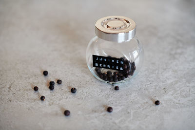 High angle view of coffee beans in glass on table