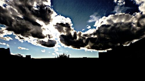 Silhouette landscape against sky