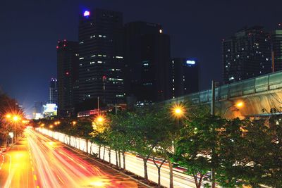 Illuminated city street at night