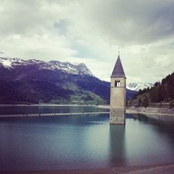 Scenic view of lake against cloudy sky