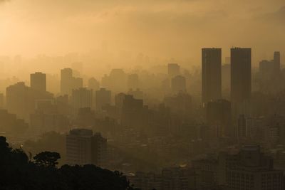 High angle view of city at sunset