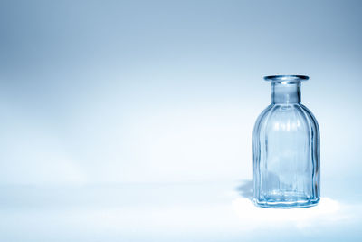 Close-up of bottle against blue background