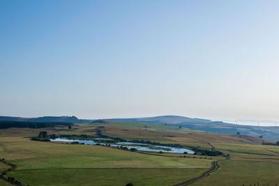 Scenic view of land against clear sky