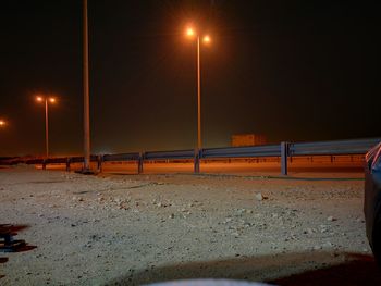 Light trails on sand at night