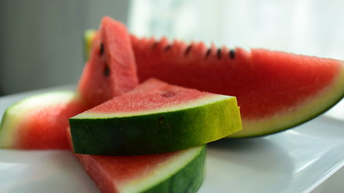 Close-up of fruit in plate on table