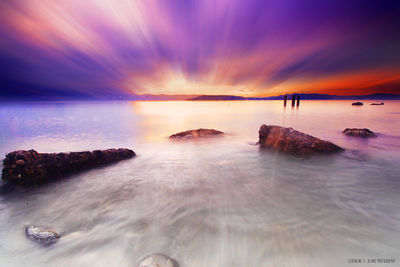 View of calm sea at sunset