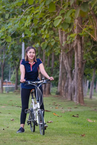 Full length portrait of man riding bicycle