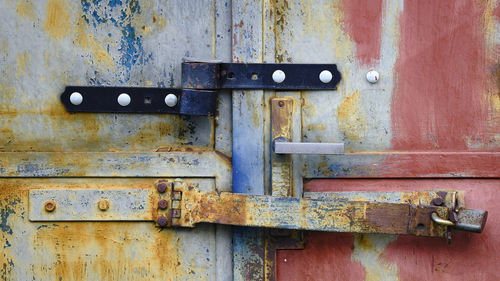 Closed colorful old metal door detail