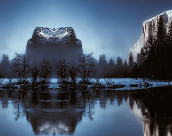 Scenic view of frozen lake against sky during winter